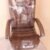Black/Red revolving office chair with cushioned backrest and metal wheel base