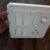 White modular electrical switch board with fan regulator and socket panel