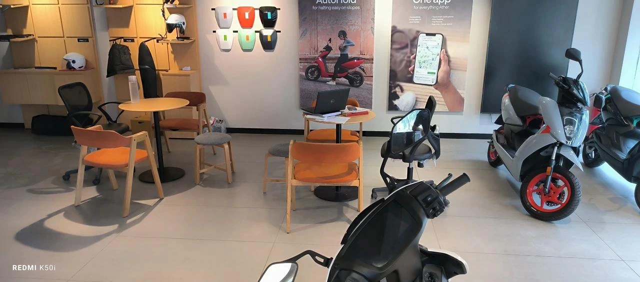 Electric Scooter Showroom Interior with Modern E-Scooters Display and Customer Seating Area